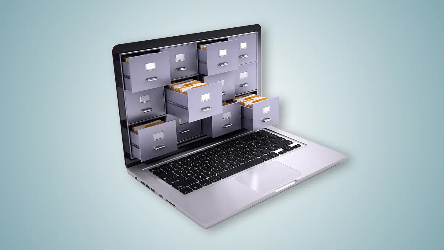 An open laptop with filing cabinet draws in place of the screen